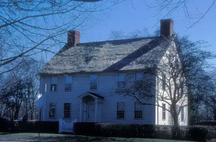 Classic white clapboard colonial home typical of Madison CT historic housing stock